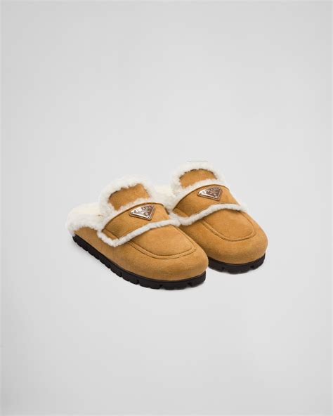 prada sluppers|Prada shearling slippers.